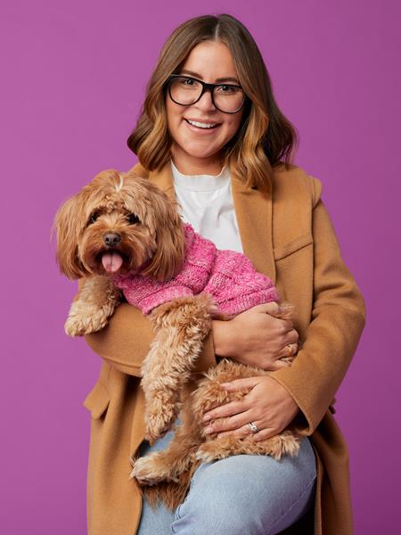 Woman holding cute dog
