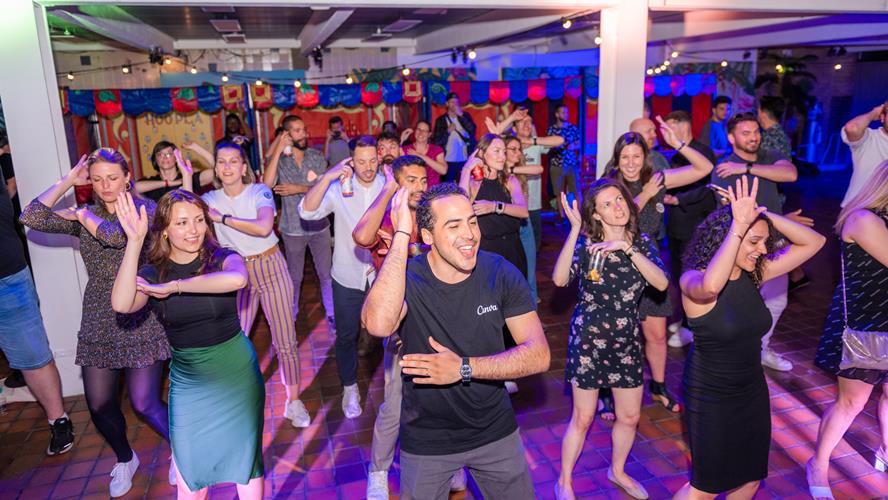 Colleagues dancing to the Macarena