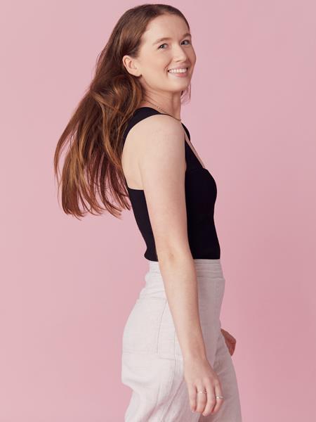 Women swaying her hair and smiling to the camera