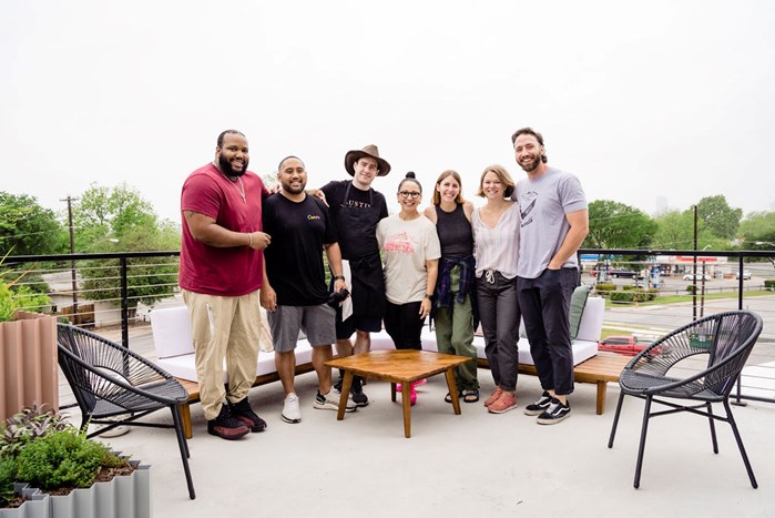 A group of Canvanauts smiling for the camera outside at our Austin campus.