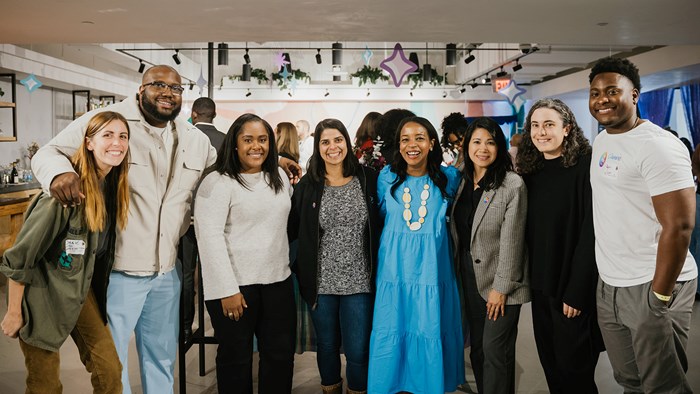 A group of Canvanauts smiling for the camera at an event at our Austin campus.