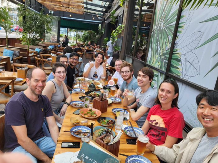A group of Canvanauts connecting over a meal at a restaurant.