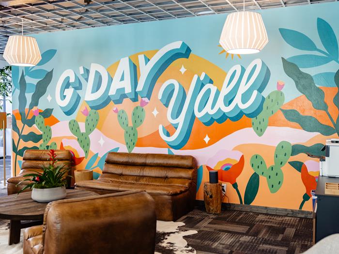 Colourful mural with 'G'day Y'all' painted on it.